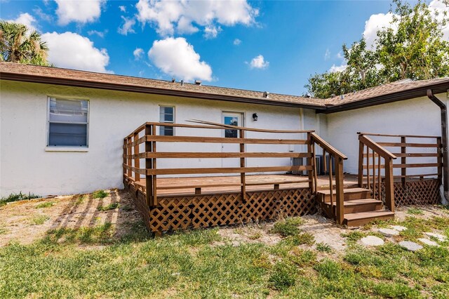 1665 Florence Ave Unit B, Englewood, FL 34223 - back of house featuring a wooden deck and stucco siding