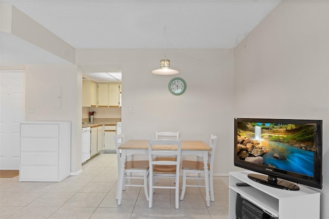 dining area with light tile patterned floors and baseboards