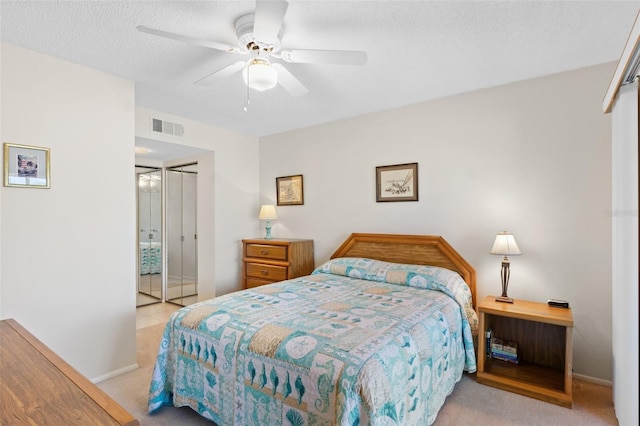 bedroom featuring carpet floors, baseboards, a closet, and visible vents