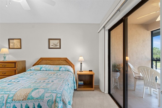 carpeted bedroom with a closet and a ceiling fan