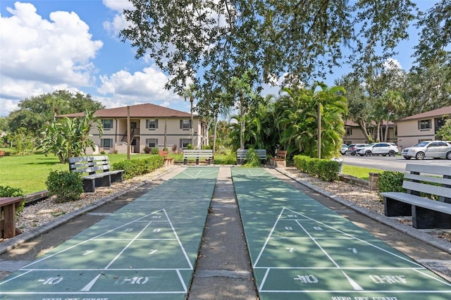 view of community with a residential view and shuffleboard