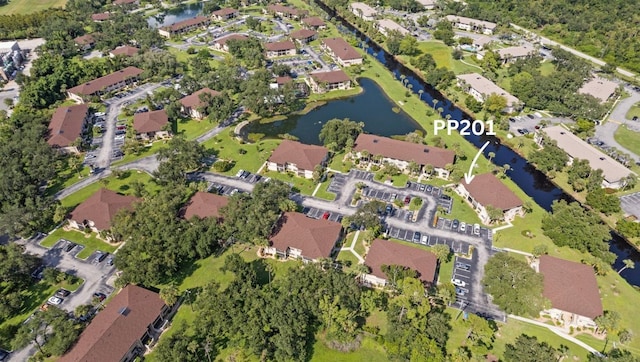 birds eye view of property with a residential view and a water view