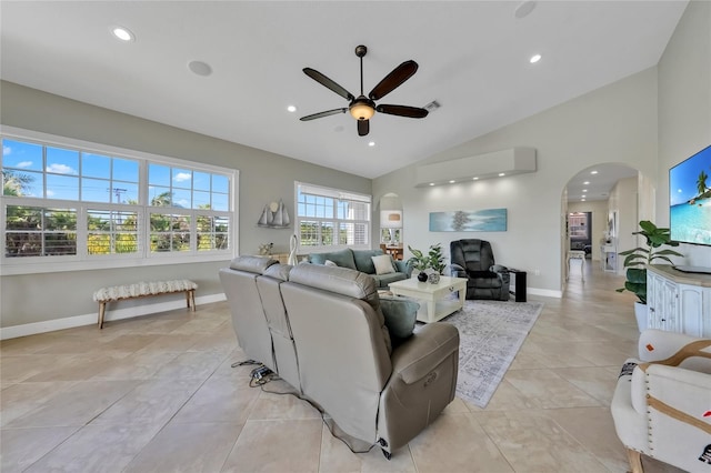 living room with arched walkways, recessed lighting, baseboards, and ceiling fan