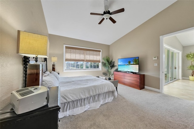 bedroom with vaulted ceiling, ceiling fan, light carpet, and baseboards