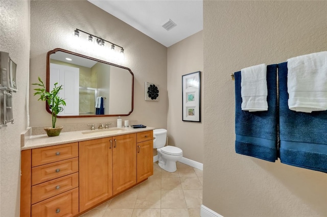 bathroom with toilet, a shower with door, tile patterned floors, visible vents, and a textured wall