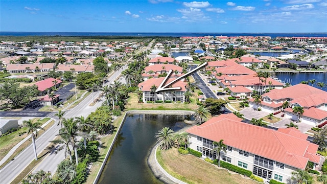 aerial view with a water view and a residential view