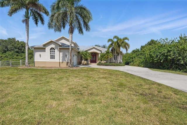1811 Irving Ave, Lehigh Acres, FL 33972 - ranch-style home with concrete driveway, stucco siding, and a garage