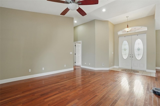 1811 Irving Ave, Lehigh Acres, FL 33972 - entryway with a ceiling fan, a towering ceiling, hardwood / wood-style floors, baseboards, and recessed lighting
