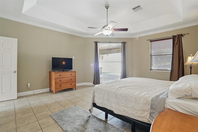 1811 Irving Ave, Lehigh Acres, FL 33972 - bedroom featuring a raised ceiling, multiple windows, light tile patterned floors, and crown molding