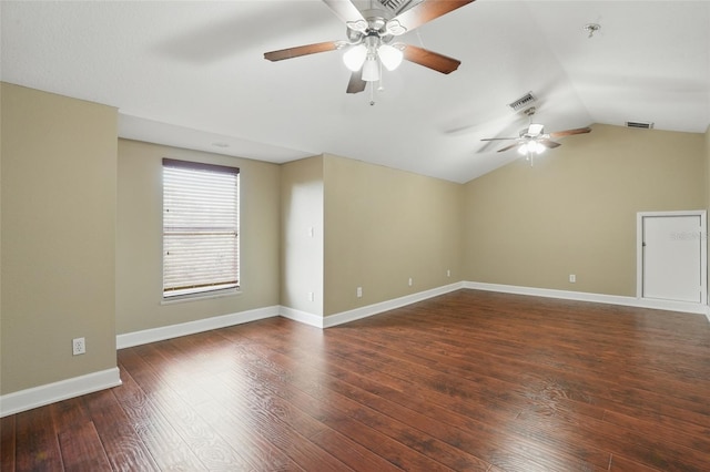 1811 Irving Ave, Lehigh Acres, FL 33972 - spare room featuring a ceiling fan, vaulted ceiling, wood-type flooring, fire sprinkler in ceiling, and baseboards
