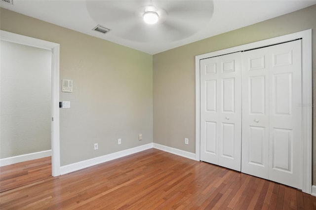 1811 Irving Ave, Lehigh Acres, FL 33972 - unfurnished bedroom featuring light wood finished floors, baseboards, and a closet