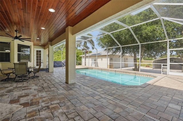 1811 Irving Ave, Lehigh Acres, FL 33972 - outdoor pool featuring a patio, glass enclosure, and a ceiling fan