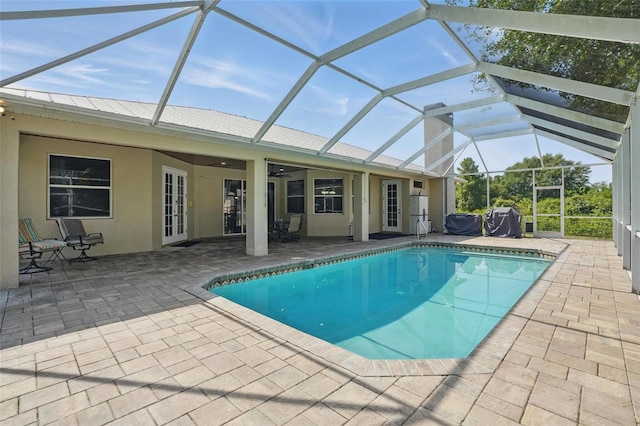 1811 Irving Ave, Lehigh Acres, FL 33972 - swimming pool featuring a patio area, a ceiling fan, and glass enclosure