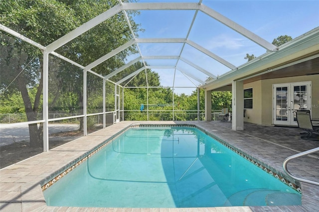 1811 Irving Ave, Lehigh Acres, FL 33972 - swimming pool with french doors, a patio area, and a lanai