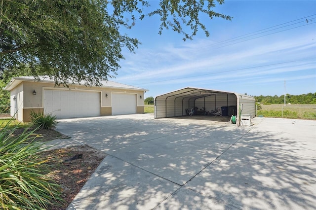 1811 Irving Ave, Lehigh Acres, FL 33972 - detached garage featuring a detached carport and driveway