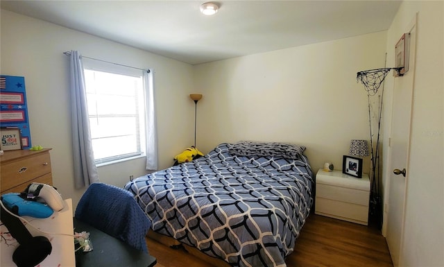 bedroom featuring wood finished floors