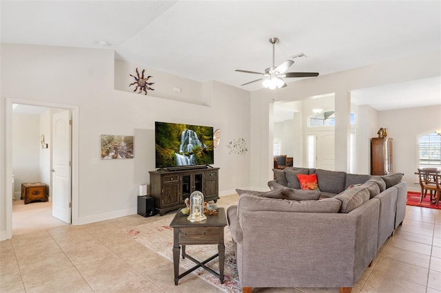 27147 Guapore Dr, Punta Gorda, FL 33983 - living room featuring vaulted ceiling, baseboards, visible vents, ceiling fan, and light tile patterned floors