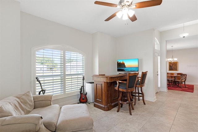 27147 Guapore Dr, Punta Gorda, FL 33983 - home office with baseboards, light tile patterned floors, and ceiling fan with notable chandelier
