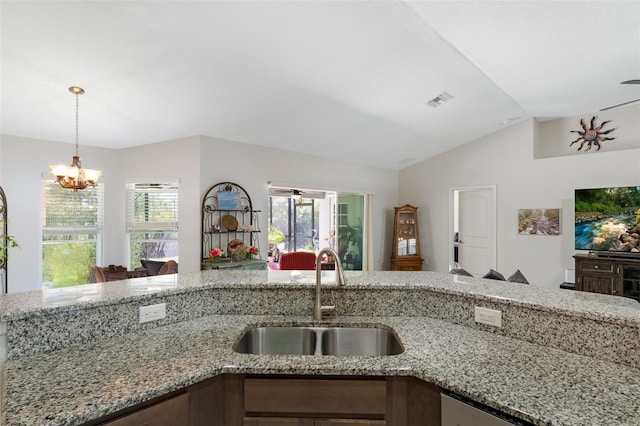 27147 Guapore Dr, Punta Gorda, FL 33983 - kitchen with a sink, open floor plan, an inviting chandelier, lofted ceiling, and visible vents