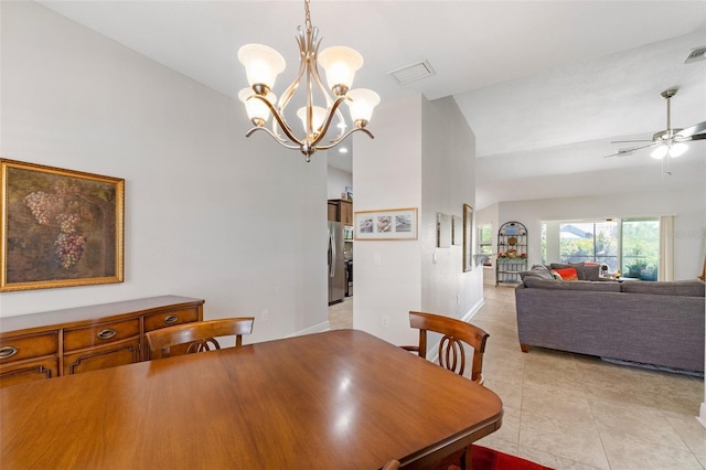 27147 Guapore Dr, Punta Gorda, FL 33983 - dining space featuring ceiling fan with notable chandelier, vaulted ceiling, visible vents, and light tile patterned flooring