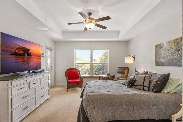 27147 Guapore Dr, Punta Gorda, FL 33983 - bedroom with light colored carpet, ceiling fan, baseboards, and a raised ceiling
