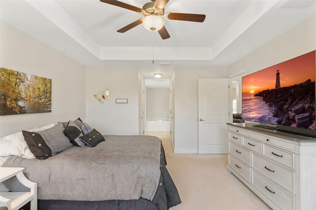 27147 Guapore Dr, Punta Gorda, FL 33983 - bedroom featuring a raised ceiling, visible vents, a ceiling fan, and light colored carpet