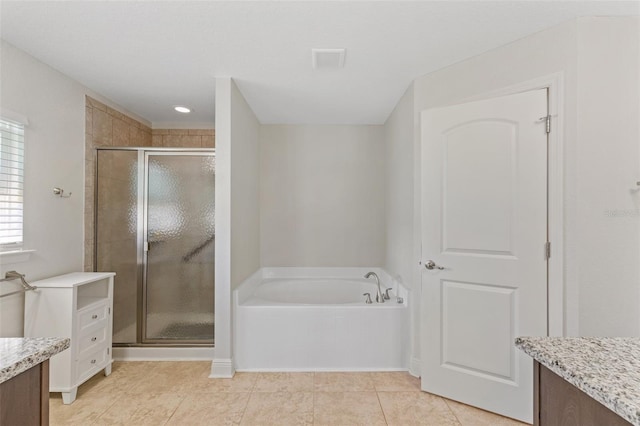 27147 Guapore Dr, Punta Gorda, FL 33983 - bathroom featuring a bath, a shower stall, tile patterned flooring, and vanity