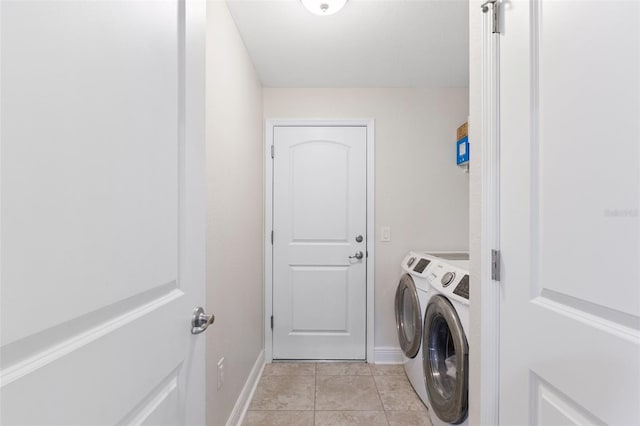 27147 Guapore Dr, Punta Gorda, FL 33983 - laundry area featuring baseboards, independent washer and dryer, laundry area, and light tile patterned floors