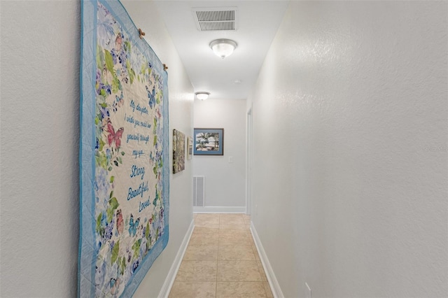 27147 Guapore Dr, Punta Gorda, FL 33983 - hall with visible vents, baseboards, and light tile patterned floors