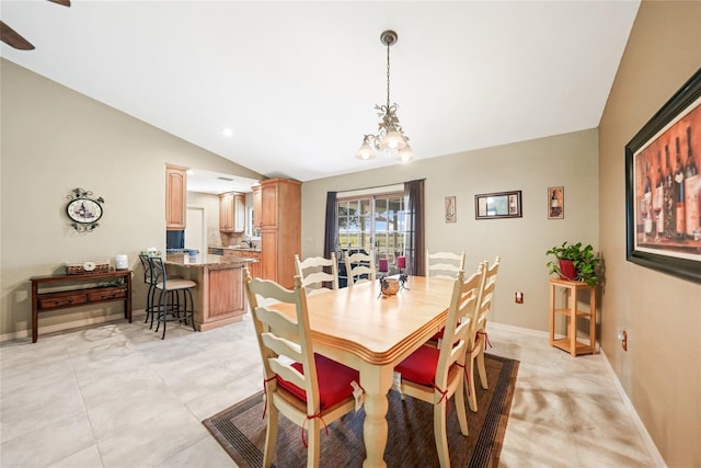 dining space with baseboards, lofted ceiling, and an inviting chandelier