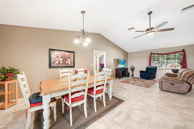 dining area featuring ceiling fan with notable chandelier, vaulted ceiling, and visible vents