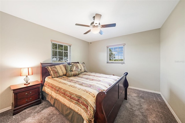 carpeted bedroom with a ceiling fan and baseboards