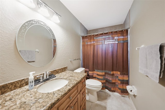 bathroom with toilet, vanity, tile patterned floors, and curtained shower