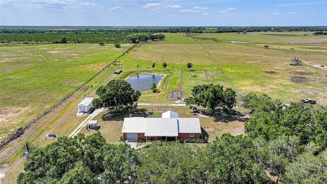 aerial view with a water view and a rural view