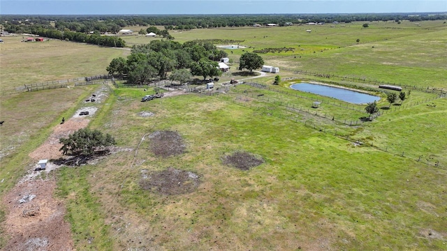 birds eye view of property featuring a water view and a rural view