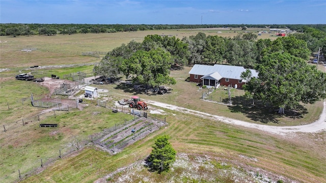 birds eye view of property with a rural view