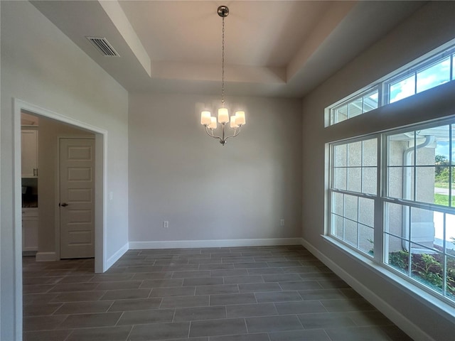 23245 Jules Ave, Port Charlotte, FL 33980 - empty room with a chandelier and a tray ceiling