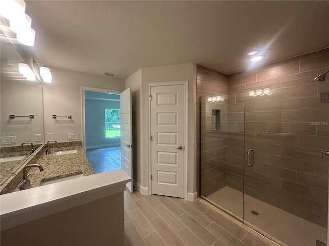 23245 Jules Ave, Port Charlotte, FL 33980 - full bathroom with a shower stall, double vanity, tile patterned flooring, and recessed lighting