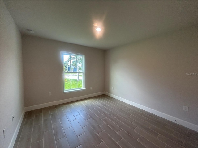 23245 Jules Ave, Port Charlotte, FL 33980 - spare room with dark wood finished floors