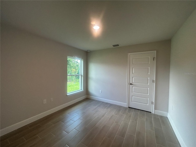 23245 Jules Ave, Port Charlotte, FL 33980 - empty room featuring wood finished floors and baseboards
