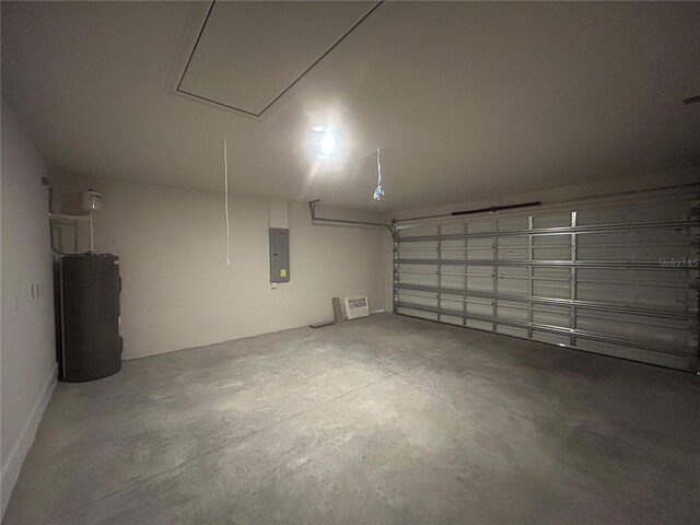 23245 Jules Ave, Port Charlotte, FL 33980 - garage featuring electric panel and water heater