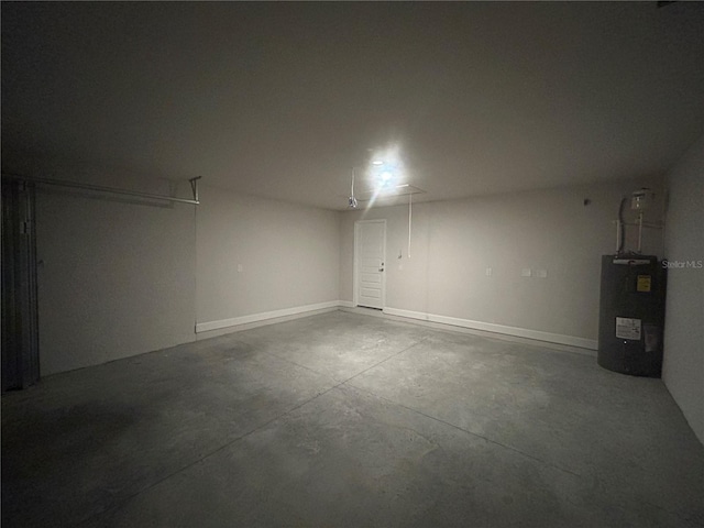 23245 Jules Ave, Port Charlotte, FL 33980 - garage with water heater and baseboards