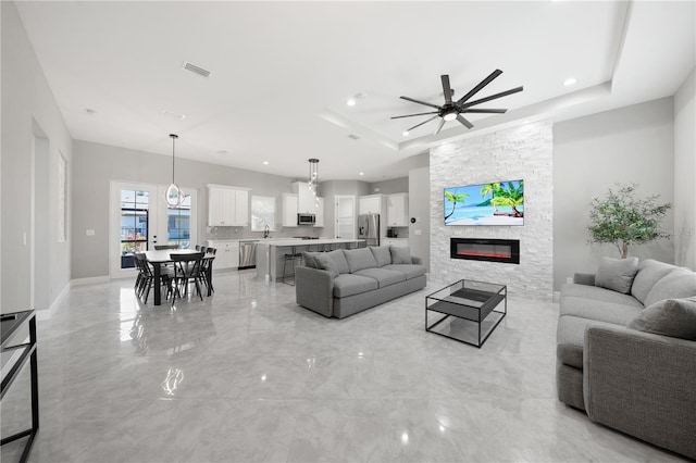 2186 Florala St, North Port, FL 34287 - living area featuring recessed lighting, a raised ceiling, visible vents, and a ceiling fan