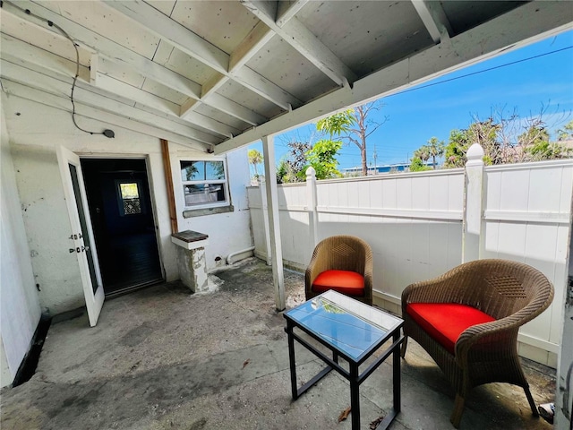 view of patio featuring fence