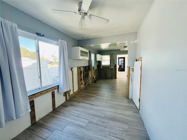corridor featuring a wall mounted air conditioner