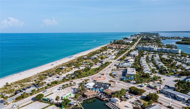 birds eye view of property featuring a beach view and a water view