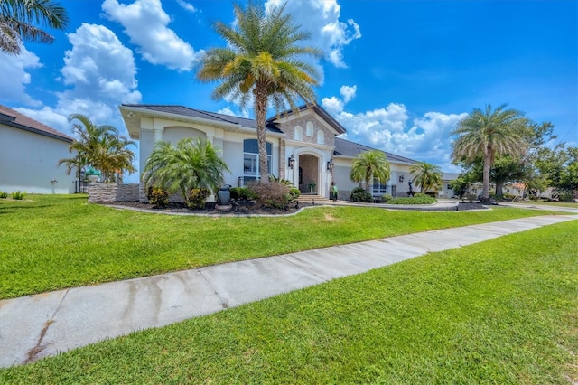3866 Turtle Dove Blvd, Punta Gorda, FL 33950 - mediterranean / spanish house with stucco siding and a front lawn