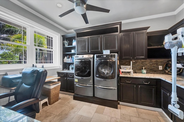 3866 Turtle Dove Blvd, Punta Gorda, FL 33950 - washroom with cabinet space, washer and clothes dryer, ceiling fan, stone tile floors, and crown molding