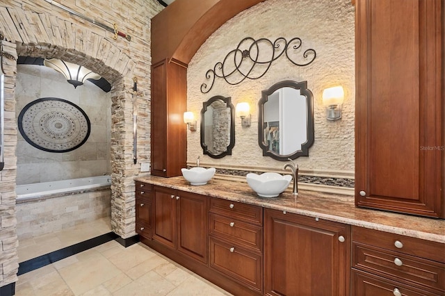 3866 Turtle Dove Blvd, Punta Gorda, FL 33950 - full bath featuring a relaxing tiled tub, stone tile flooring, and double vanity