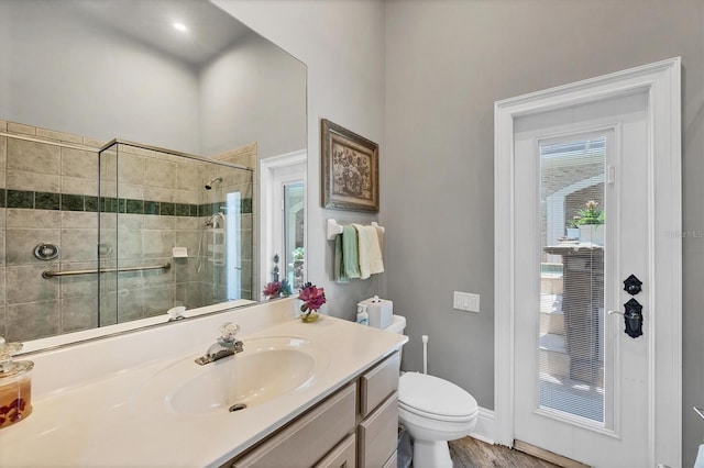 3866 Turtle Dove Blvd, Punta Gorda, FL 33950 - full bath with toilet, vanity, a stall shower, baseboards, and wood finished floors